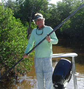Capt. Larry Sydnor poling backcountry creek